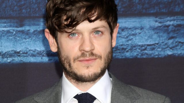Actor Iwan Rheon on the red carpet at a Game of Thrones premiere.