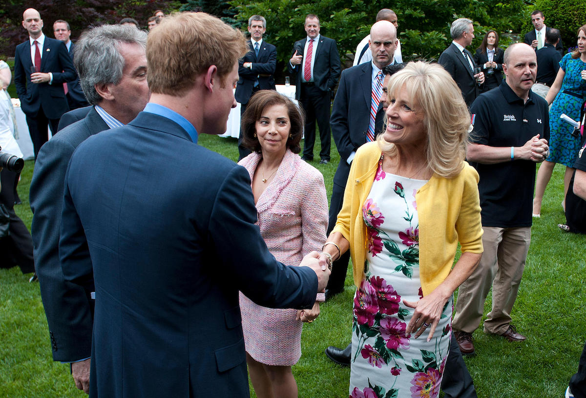 Prince Harry greets Dr Jill Biden (R), the wife of U.S Vice President Joe Biden, during a reception for U.S and British wounded warriors at the British Ambassador's Residence in Washington, D.C on May 7, 2012