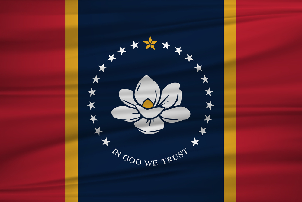 The new state flag of Mississippi with red, gold, and blue bars and a magnolia flower