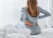 Woman with back pain from sleeping on her stomach