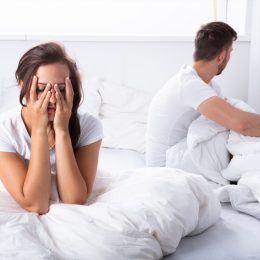 Couple fighting in bed bad sleep position