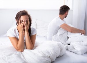 Couple fighting in bed bad sleep position