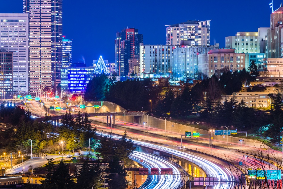 city skyline and busy highway in Seattle, Washington at night
