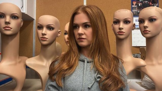 Isla Fisher with mannequin heads