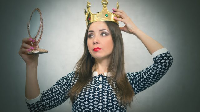 Selfish woman wearing a crown