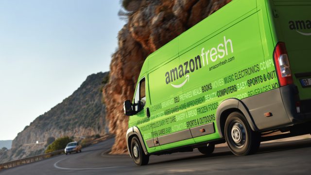 mazon Fresh delivery van speeding by countryside
