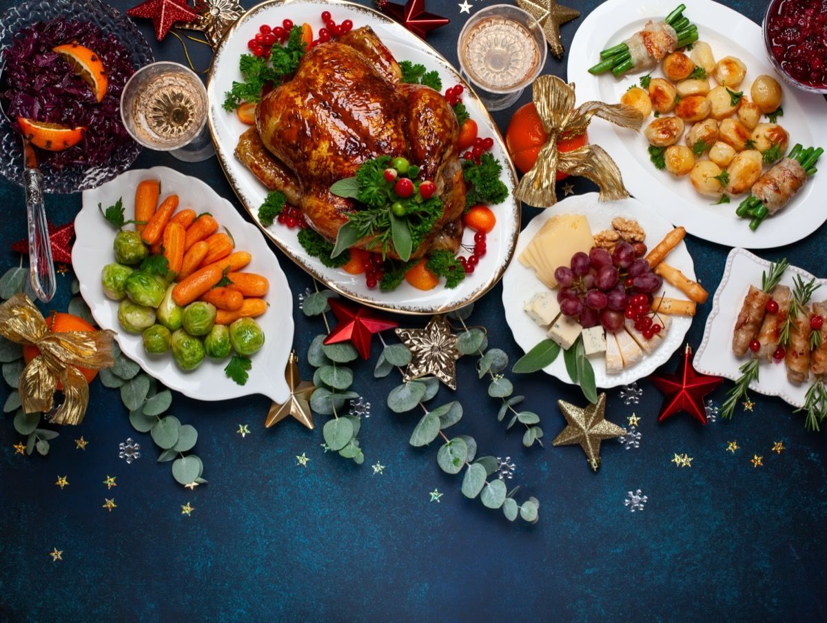 https://bestlifeonline.com/wp-content/uploads/sites/3/2020/12/christmas-food.jpg?quality=82&strip=all