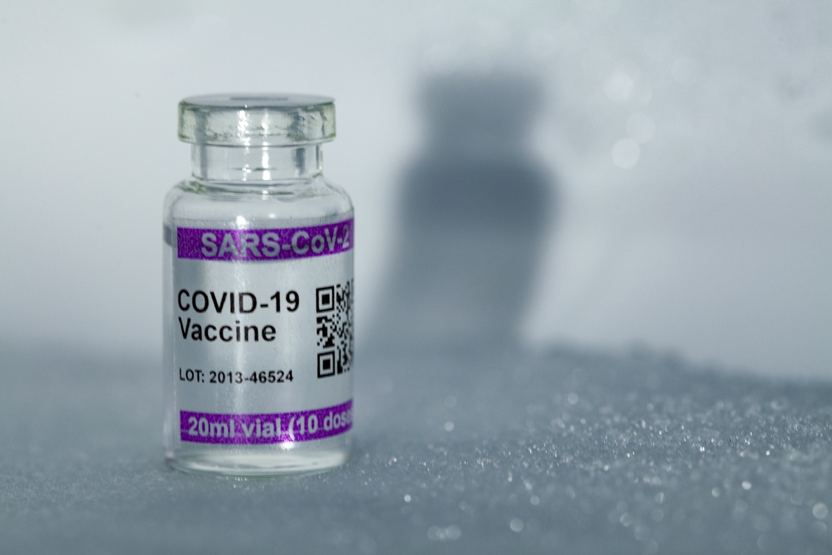 Bottles with COVID-19 (SARS-CoV-2) Coronavirus vaccine vial. Copy space provided. Note: QR code on bottles was generated by me and contains generic text: "SARS-CoV-2 Vaccine"