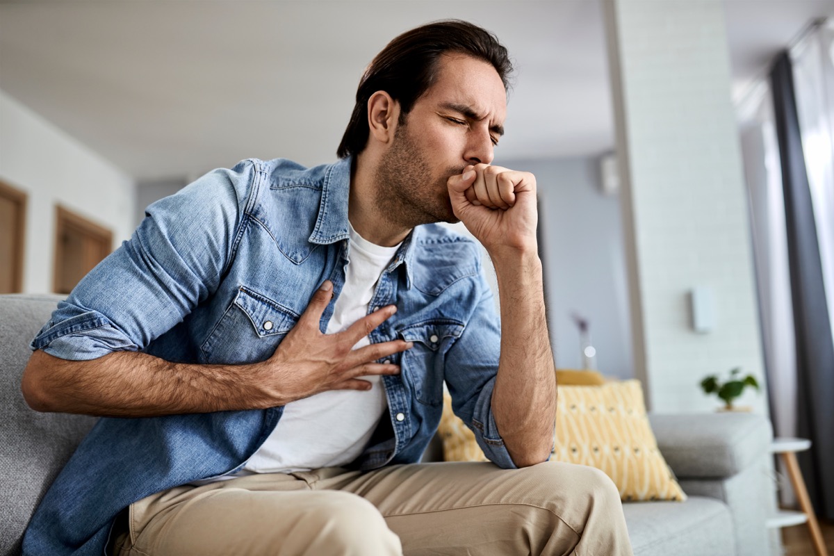 Man coughing at home
