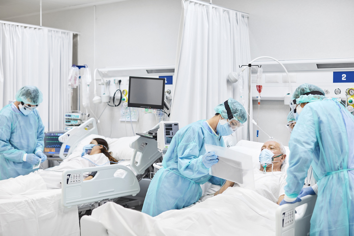 Doctors and Nurses Taking Care of COVID Patients in ICU