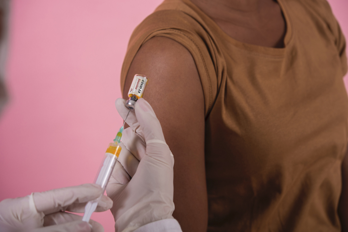closeup of woman taking the Covid-19 vaccine.