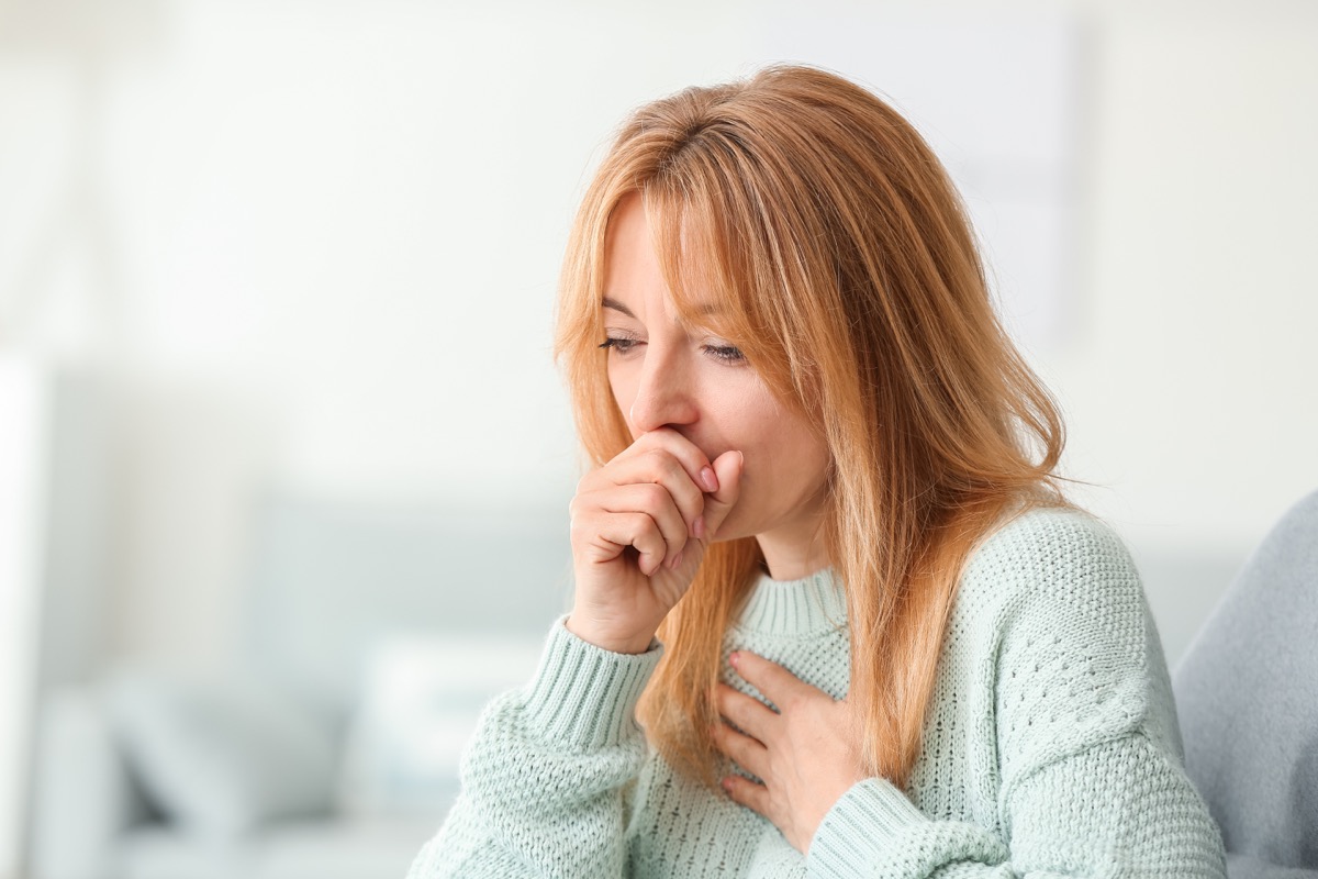 Woman with COVID coughing