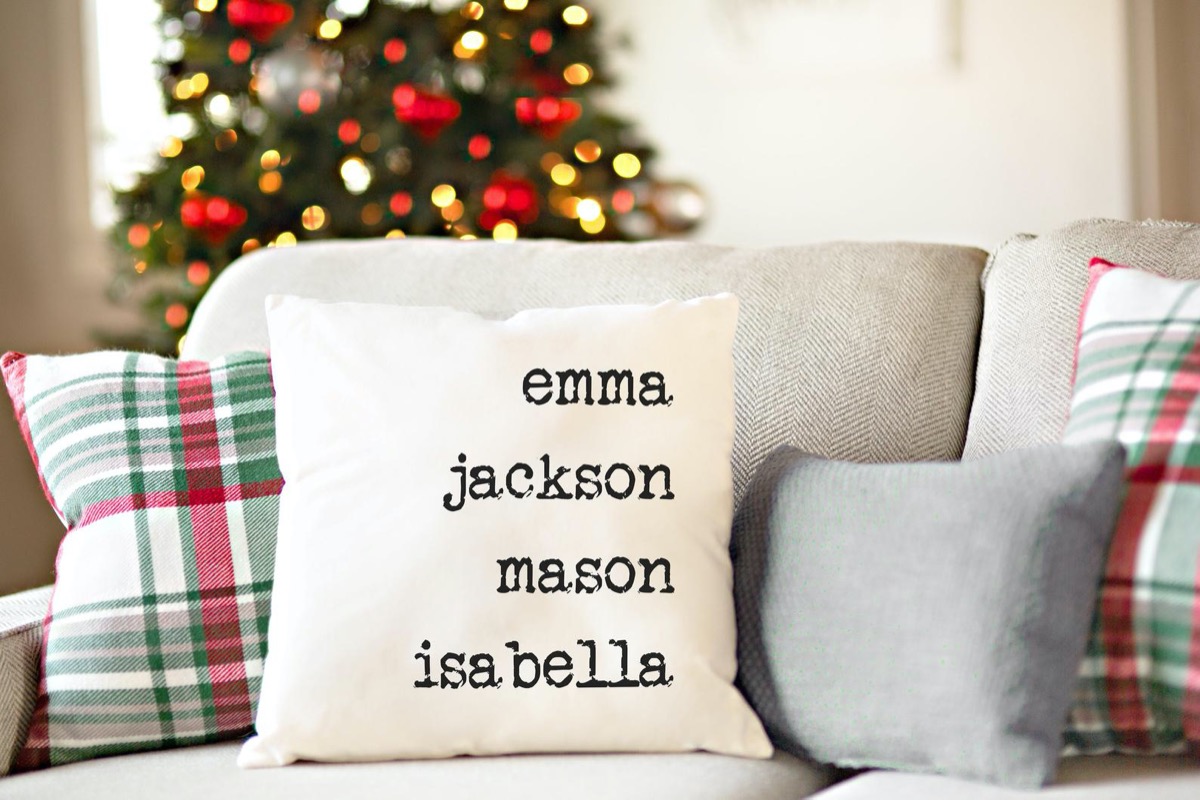 white pillow with names in black ink