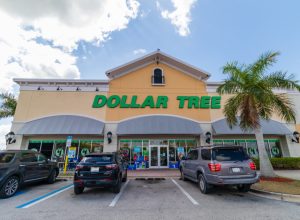 the outside of and parking lot in front of a Dollar Tree Store in Fort Myers, Florida