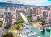 An aerial shot of downtown Honolulu, Hawaii from the water looking inland.