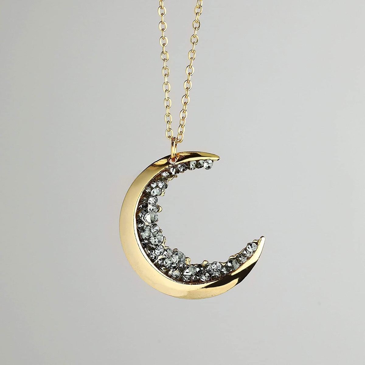 gold half moon necklace with black jewels
