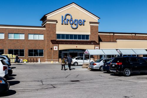 the entrance of and parking lot in front of a Kroger retail store in Indianapolis, Indiana