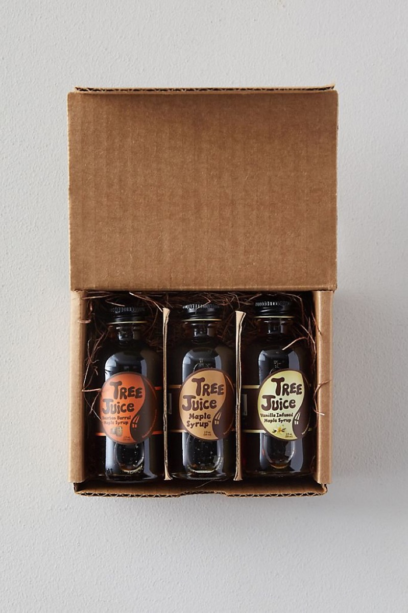 three maple syrups in brown box