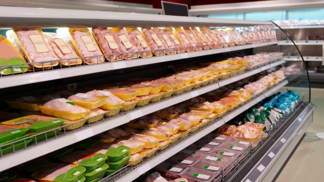 Fresh chicken meat on supermarket shelf