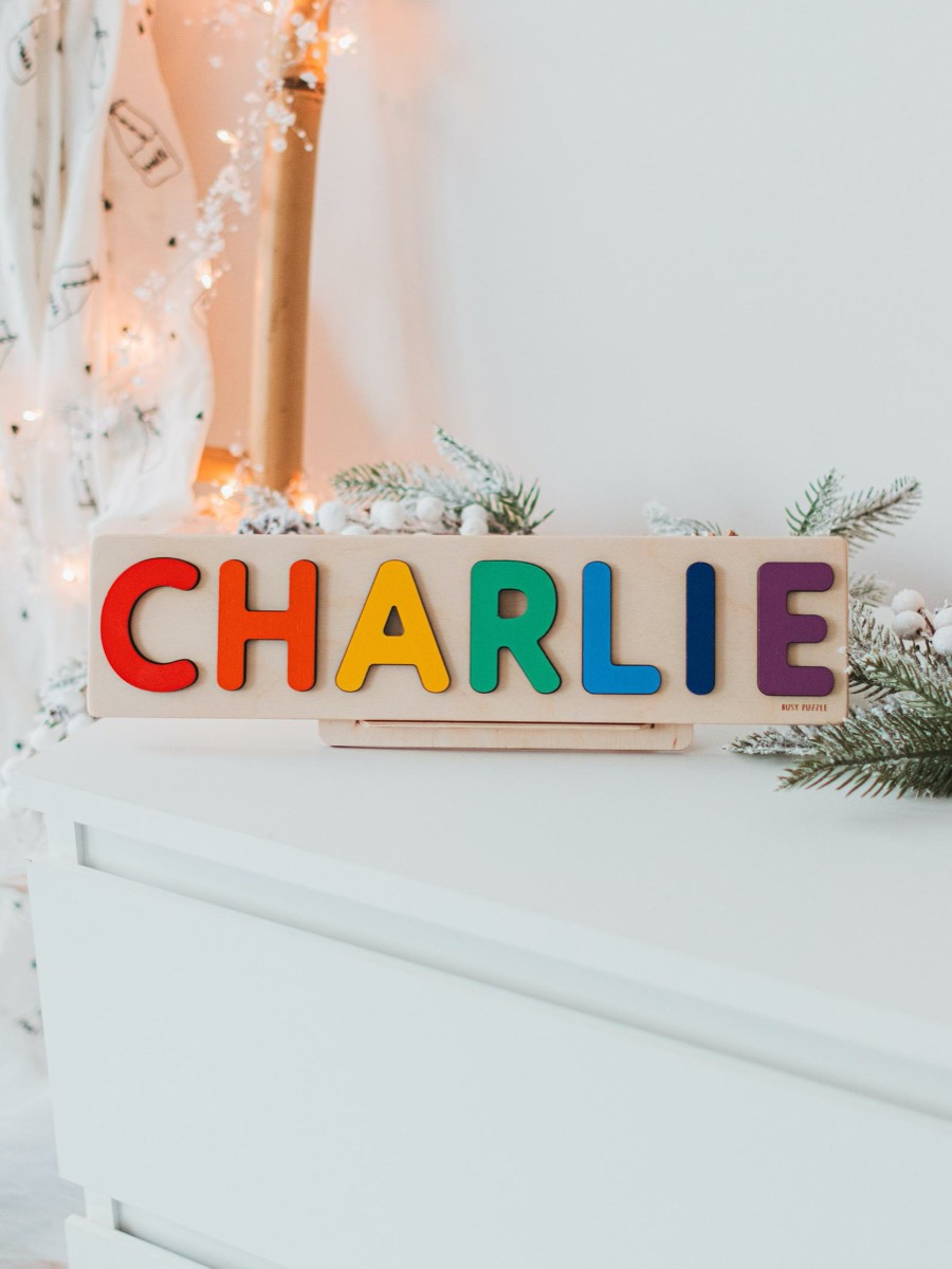 wooden puzzle with letters reading "Charlie"