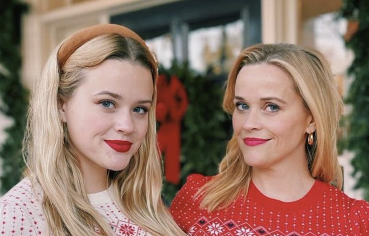 reese witherspoon and ava phillippe pose in matching draper james holiday sweaters