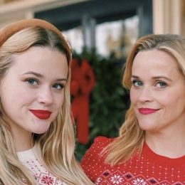 reese witherspoon and ava phillippe pose in matching draper james holiday sweaters