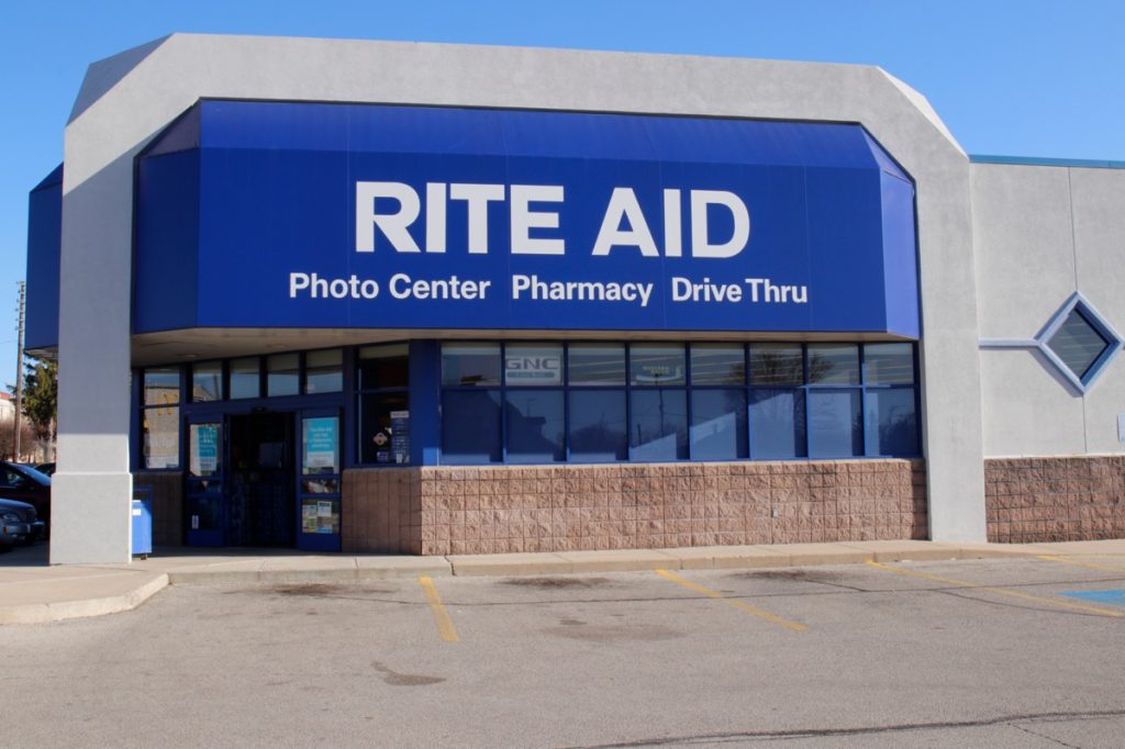 the entrance of and parking lot of a Rite Aid store in Union City, New Jersey