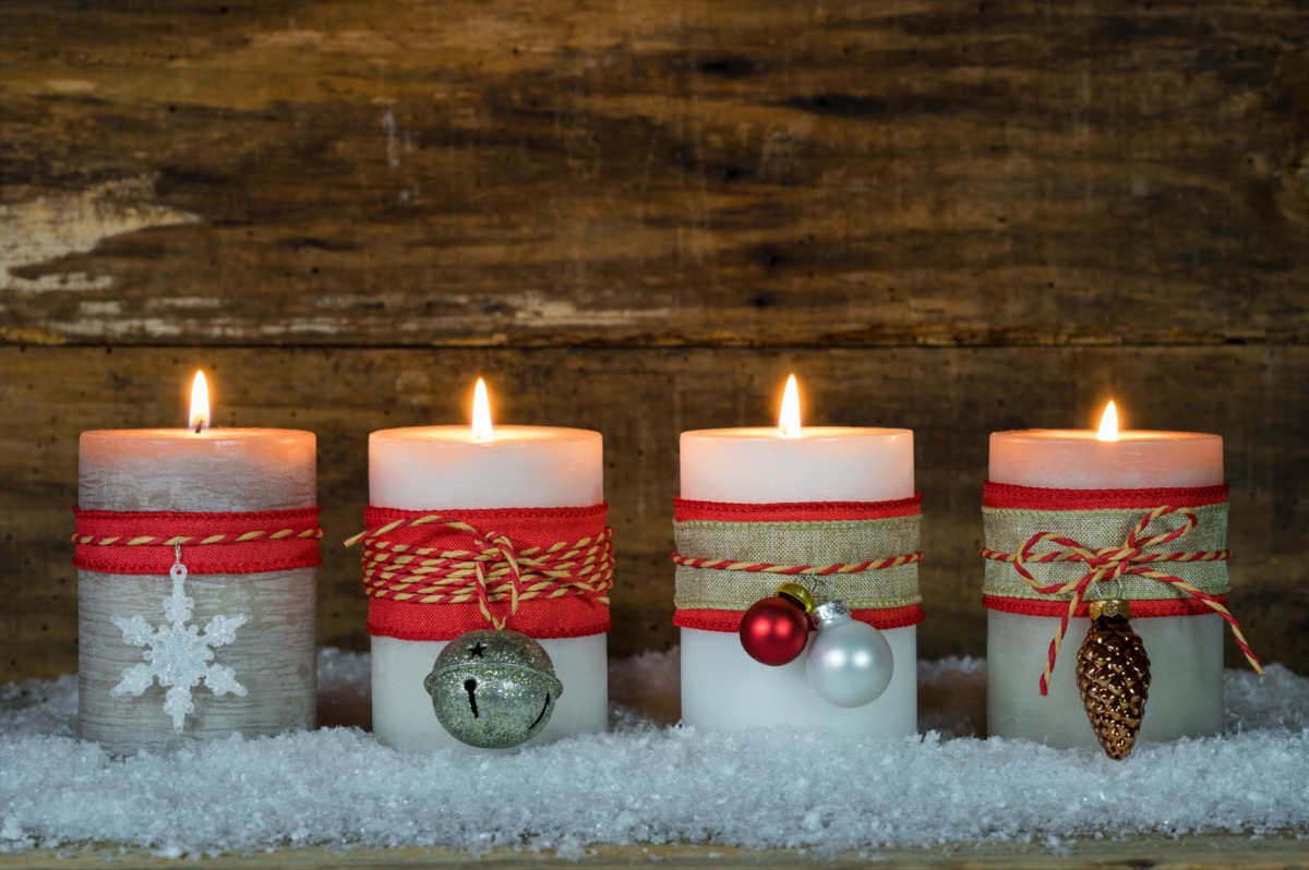 three scented holiday candles