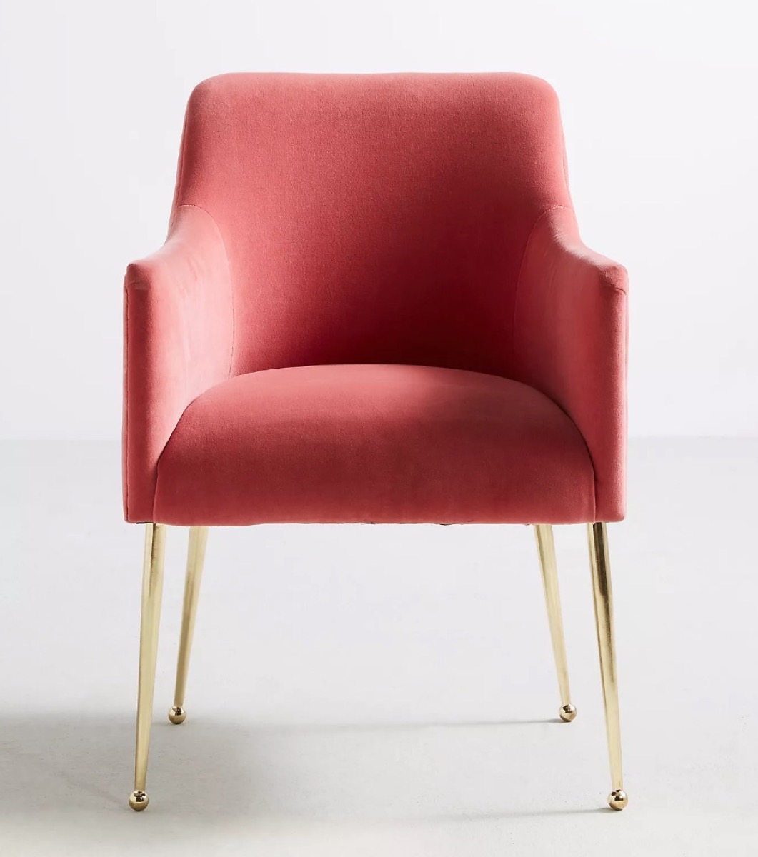 pink velvet armchair with gold legs