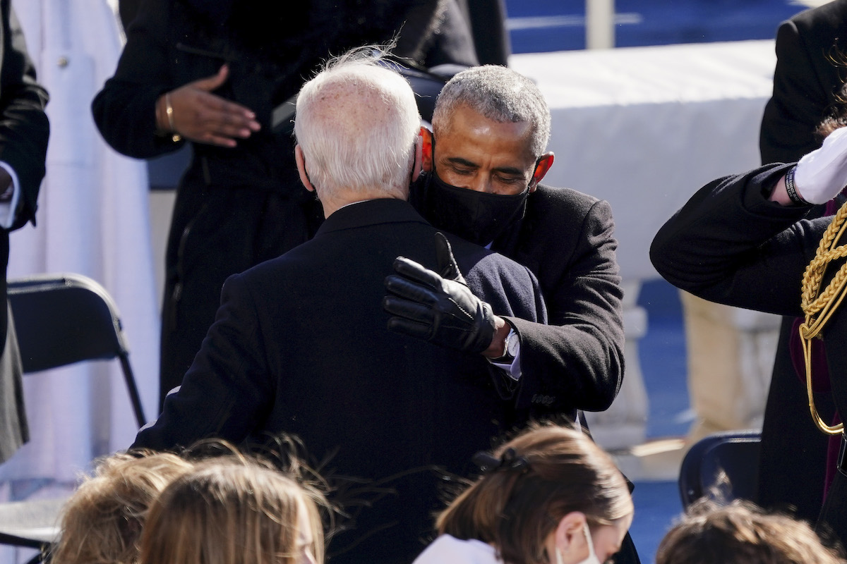 Former US President Barack Obama (R) hugs US President Joe Biden during the Presidential Inauguration ceremony on January 20, 2021, at the US Capitol in Washington, DC.