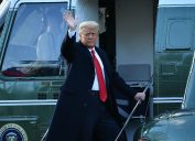 donald trump waves as he boards marine one helicopter