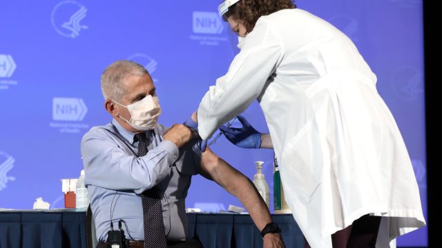 Top infectious disease expert Anthony Fauci receives a coronavirus vaccine from Moderna in Washington, DC, United States on December 22, 2020. The vaccinations were done as part of a National Institutes of Health (NIH) event where Director Francis Collins, Office of Research Services Director Colleen McGowan and health care workers also received the vaccine.
