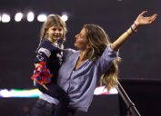 Gisele Bundchen celebrates with daughter Vivian Brady after the New England Patriots defeated the Atlanta Falcons during Super Bowl 51 at NRG Stadium on February 5, 2017 in Houston, Texas