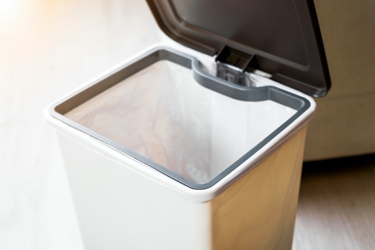 black and white trash can with open lid