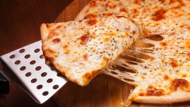 cheese pizza on a metal spatula