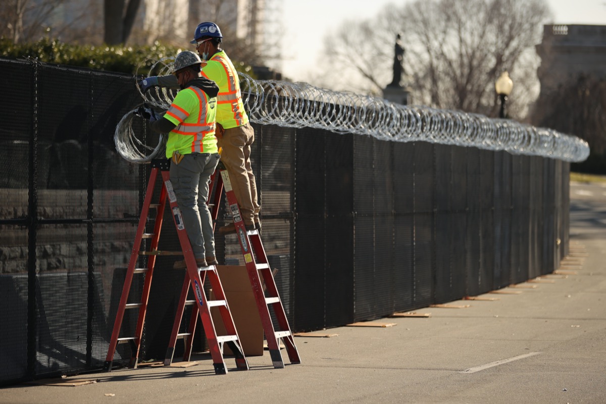 workers install razor wire outside us capitol