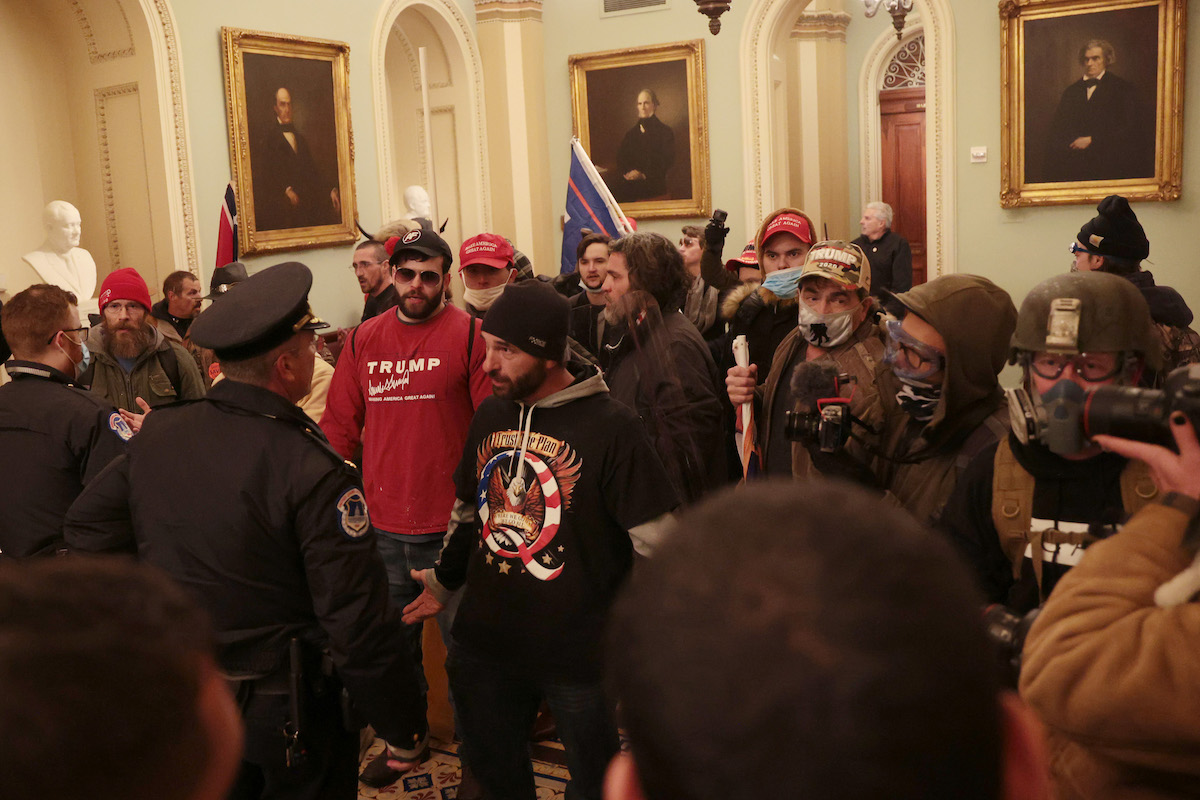 Protesters interact with Capitol Police inside the U.S. Capitol Building on January 06, 2021 in Washington, DC. Congress held a joint session today to ratify President-elect Joe Biden's 306-232 Electoral College win over President Donald Trump. A group of Republican senators said they would reject the Electoral College votes of several states unless Congress appointed a commission to audit the election results.
