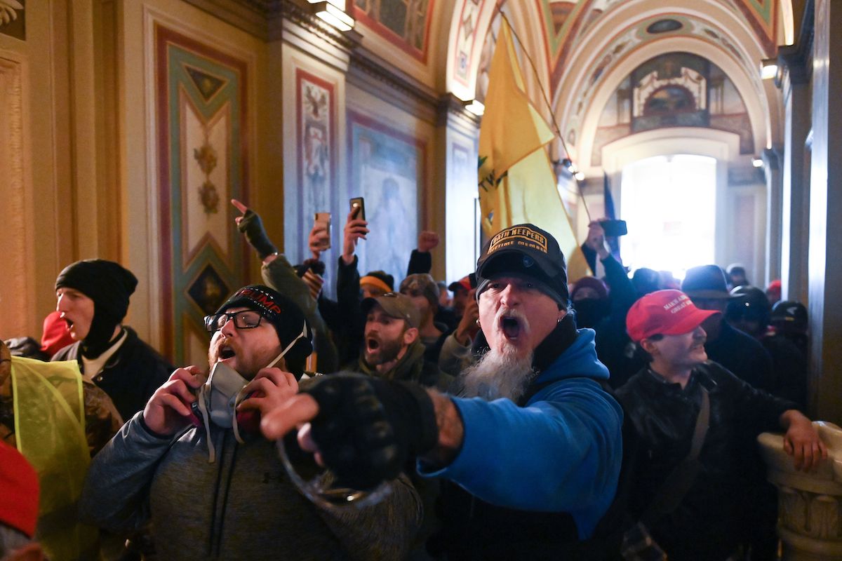 Supporters of US President Donald Trump protest inside the US Capitol on January 6, 2021, in Washington, DC. - Demonstrators breeched security and entered the Capitol as Congress debated the a 2020 presidential election Electoral Vote Certification.