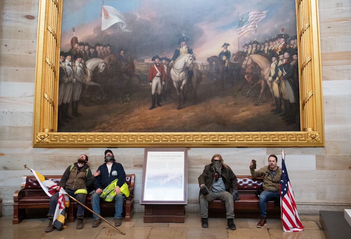 Supporters of US President Donald Trump protest in the US Capitol Rotunda on January 6, 2021, in Washington, DC. - Demonstrators breeched security and entered the Capitol as Congress debated the a 2020 presidential election Electoral Vote Certification. (