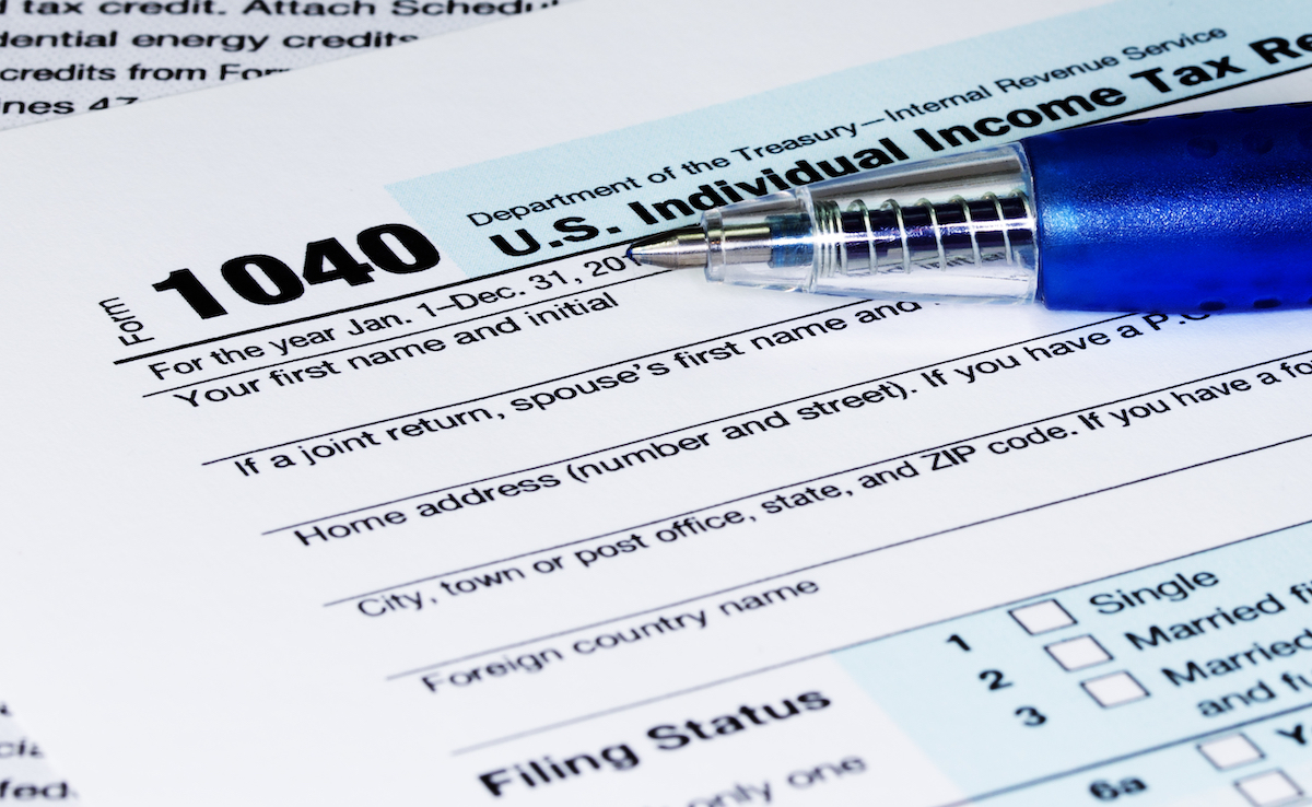 1040 Tax Return Form with a Pen