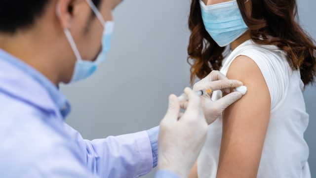 Woman getting covid vaccine