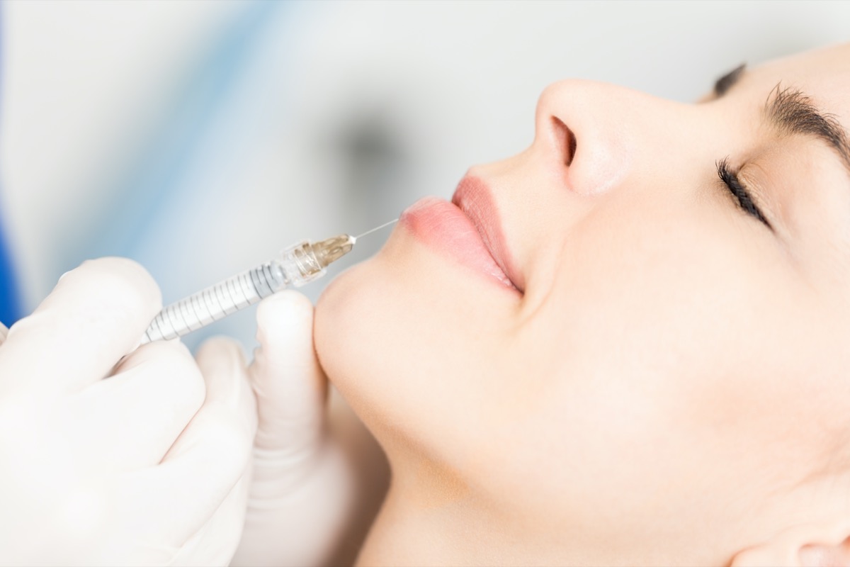 woman getting injectable filler from doctor