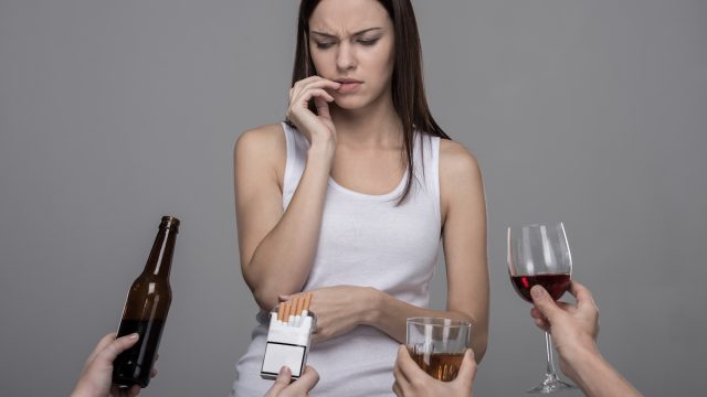 Woman tempted by bad habits