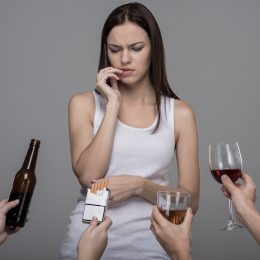 Woman tempted by bad habits