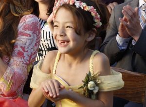 Lily on Modern Family in the episode where Mitch and Cam get married