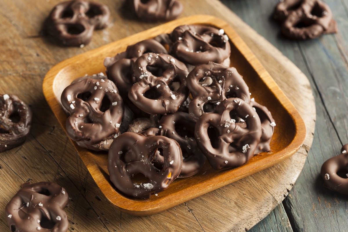 chocolate pretzels on wooden tray