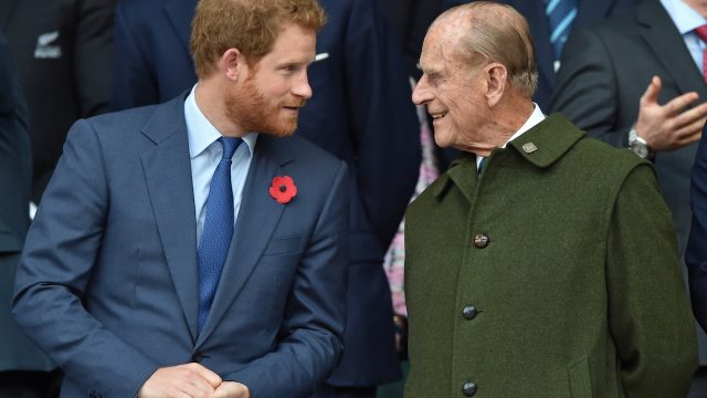 Prince Harry and Prince Philip, Duke of Edinburgh attend the 2015 Rugby World Cup Final match between New Zealand and Australia at Twickenham Stadium on October 31, 2015 in London, England.