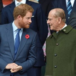 Prince Harry and Prince Philip, Duke of Edinburgh attend the 2015 Rugby World Cup Final match between New Zealand and Australia at Twickenham Stadium on October 31, 2015 in London, England.