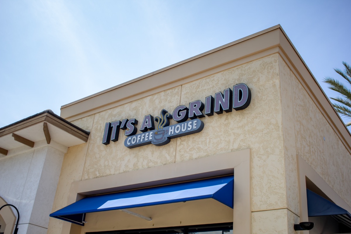 the sign of an It's A Grind Coffee Shop in Corona, California