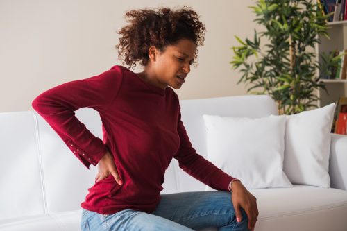 Woman suffering back pain